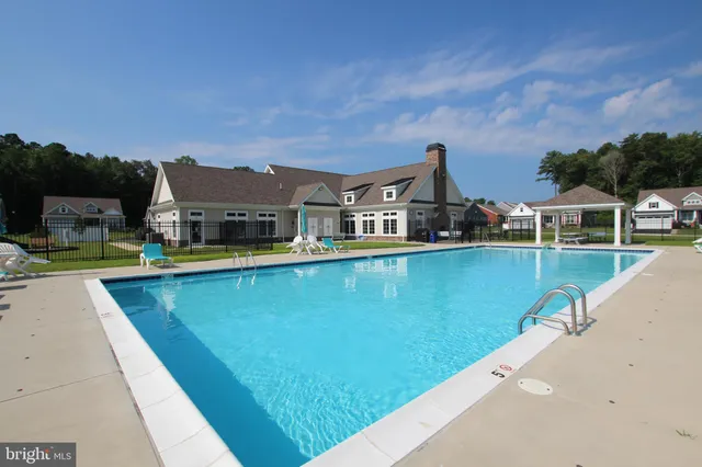 a view of a lake with a house in the background