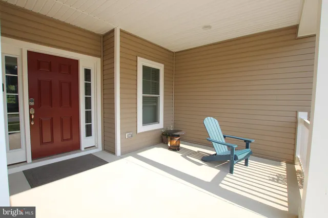 a view of a bedroom with a lounge chair