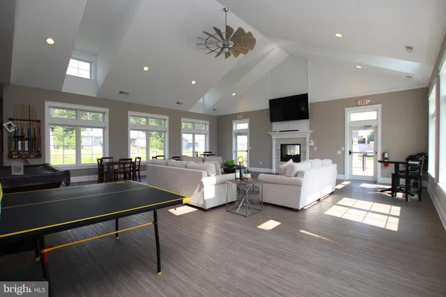 a living room with furniture fireplace and a flat screen tv