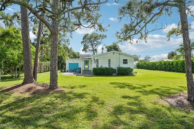 a view of a house with a big yard
