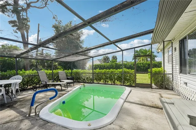 a view of a swimming pool with a patio