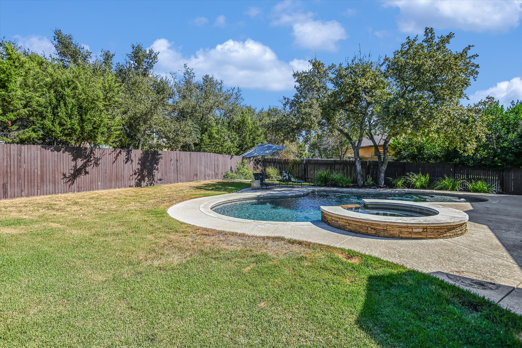 4213 Arrow Wood Road Cedar Park, TX 78613 - Photo 30 of 31 Large backyard space beyond the pool