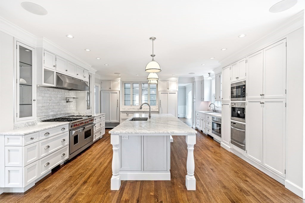 106 Clinton Road Brookline, MA 02445 - Photo 11 of 42 a large kitchen with stainless steel appliances granite countertop a stove oven and a refrigerator
