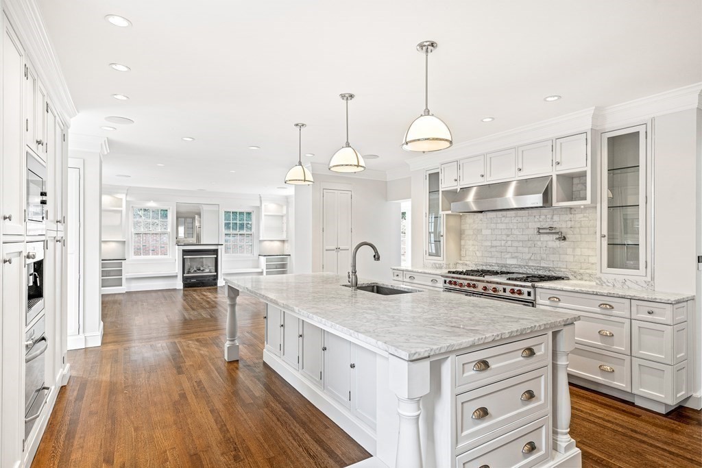 106 Clinton Road Brookline, MA 02445 - Photo 12 of 42 a kitchen with stainless steel appliances granite countertop a stove and cabinets