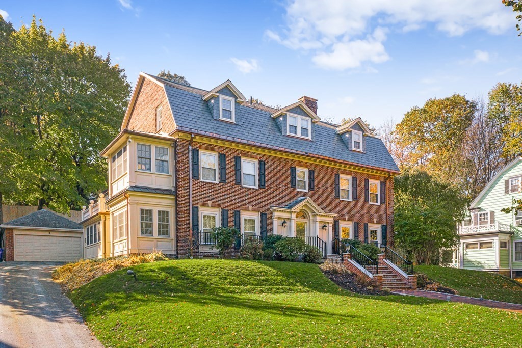 106 Clinton Road Brookline, MA 02445 - Photo 2 of 42 a front view of a house with a yard