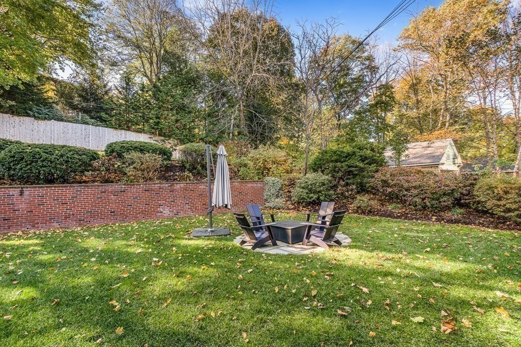 106 Clinton Road Brookline, MA 02445 - Photo 38 of 42 a view of a chair and table in the garden