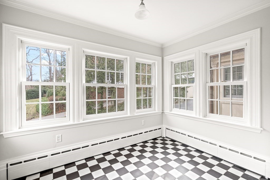106 Clinton Road Brookline, MA 02445 - Photo 10 of 42 a view of an empty room with a window