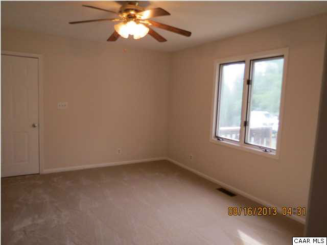 3 Deer Path Road Palmyra, VA 22963 - Photo 7 of 13 an empty room with a window