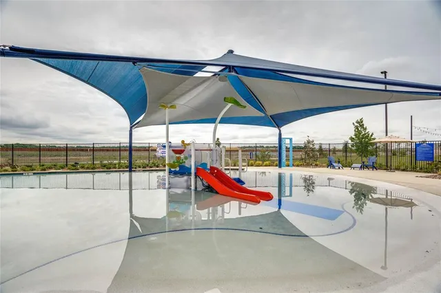 a view of a swimming pool with a lounge chairs