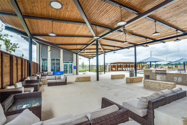 a view of a building with sitting area