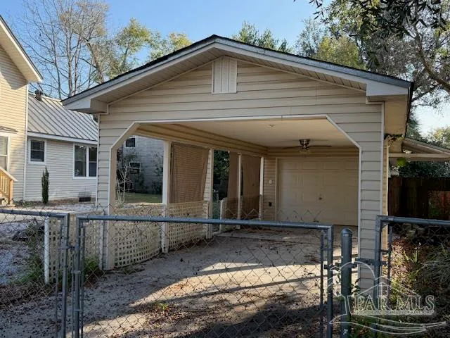 a view of house with backyard