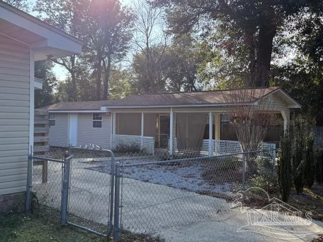 a front view of house with yard outdoor seating and barbeque oven