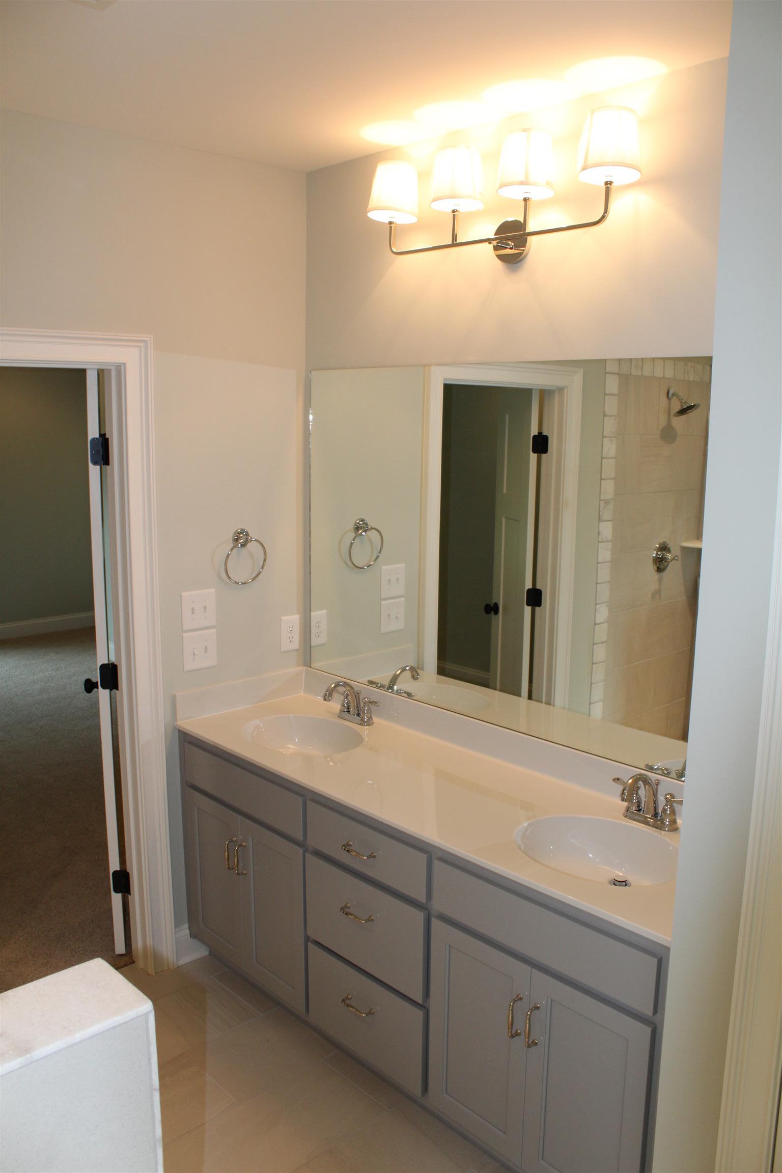 1381 Walnut Hill Road Lebanon, TN 37090 - Photo 17 of 26 a bathroom with a granite countertop sink mirror and double