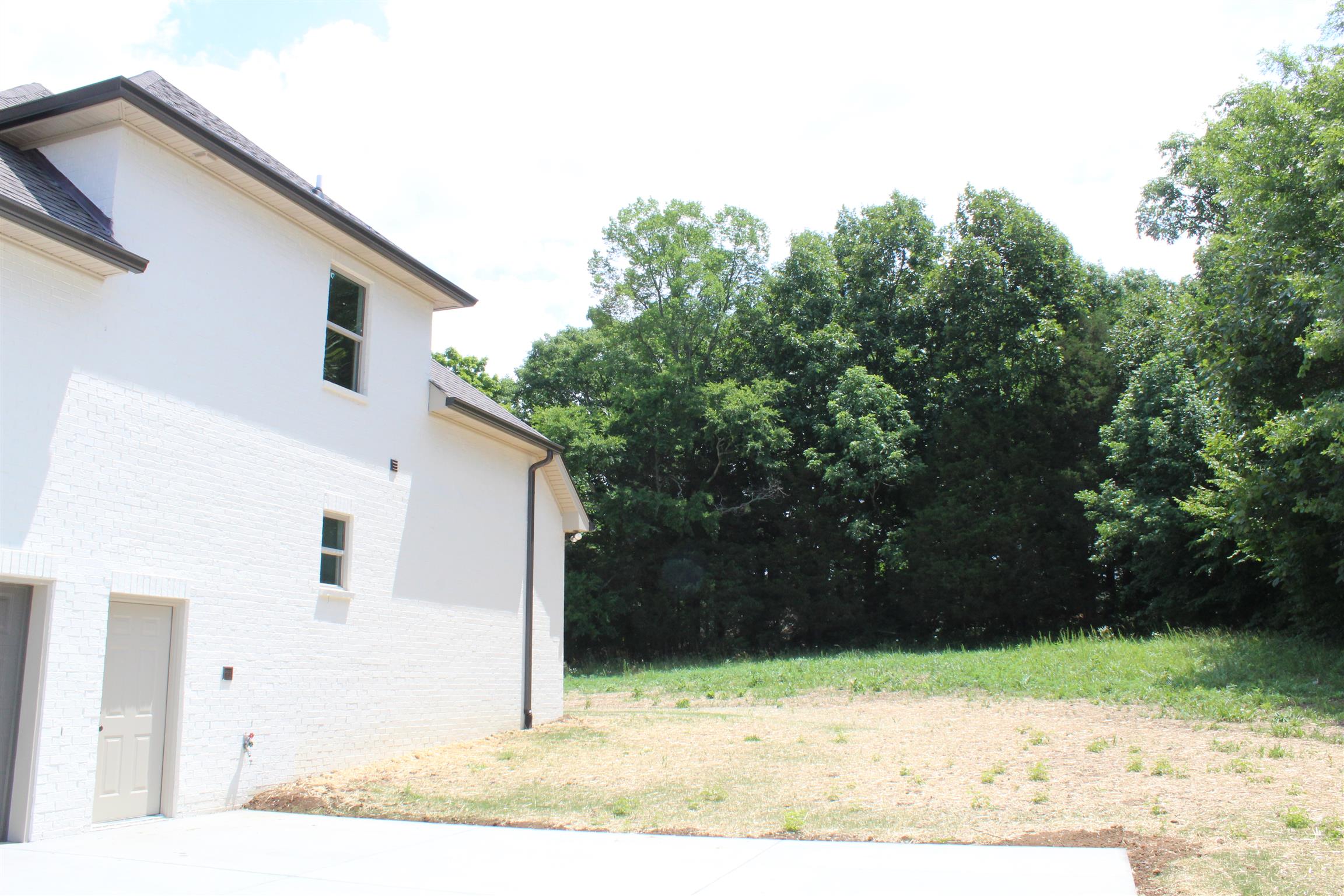 1381 Walnut Hill Road Lebanon, TN 37090 - Photo 26 of 26 a front view of a house with a yard