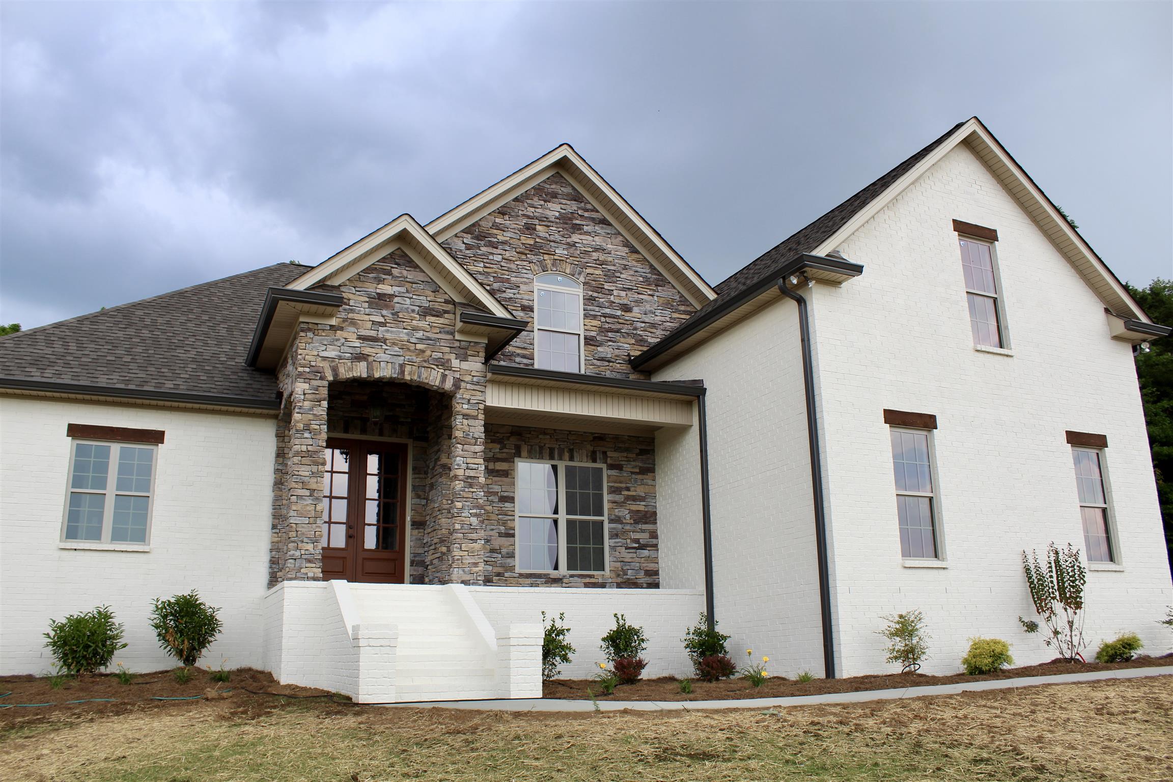 1381 Walnut Hill Road Lebanon, TN 37090 - Photo 4 of 26 a front view of a house with a yard
