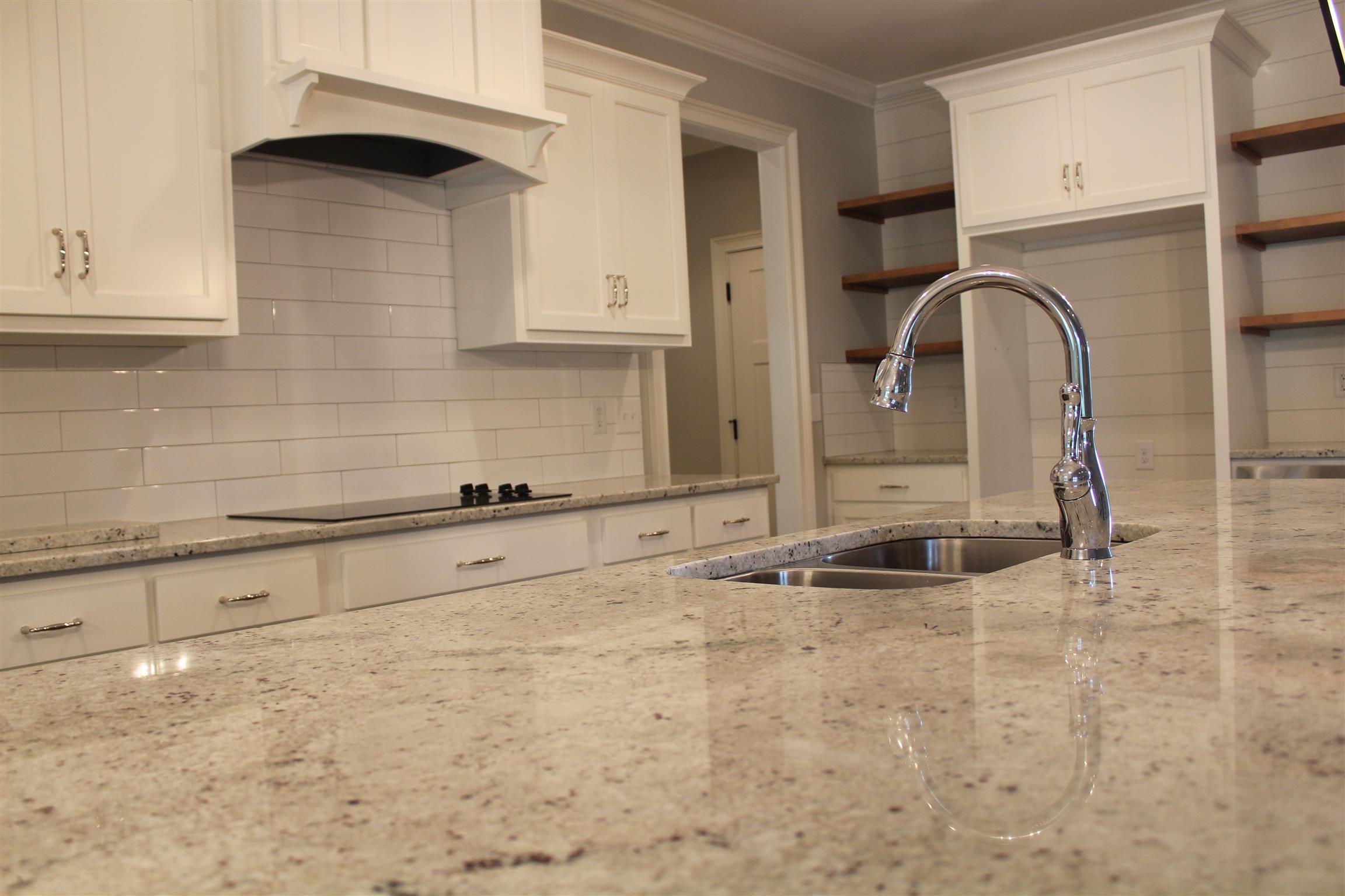 1381 Walnut Hill Road Lebanon, TN 37090 - Photo 8 of 26 a kitchen with granite countertop a sink and cabinets