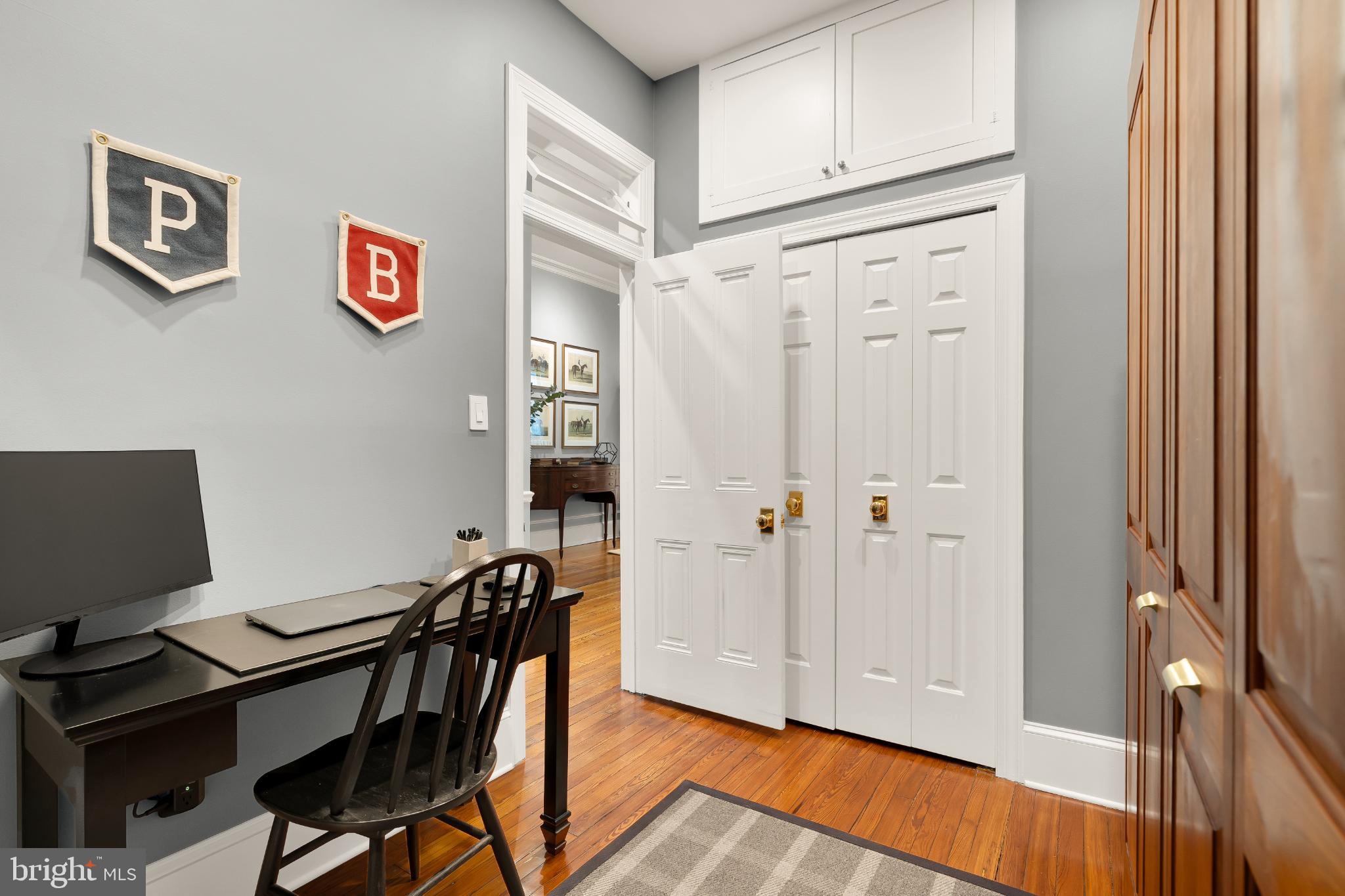 1704 19th Street Northwest, Unit 5 Washington, DC 20009 - Photo 13 of 25 a view of a workspace with furniture and wooden floor