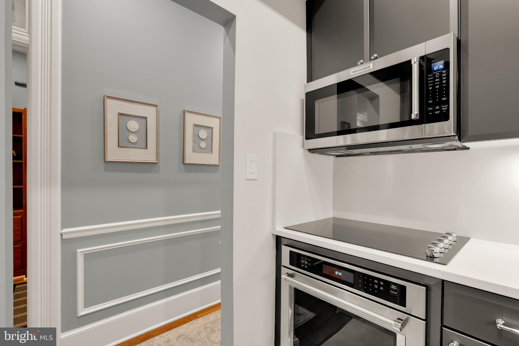 1704 19th Street Northwest, Unit 5 Washington, DC 20009 - Photo 16 of 25 a microwave oven on the wall