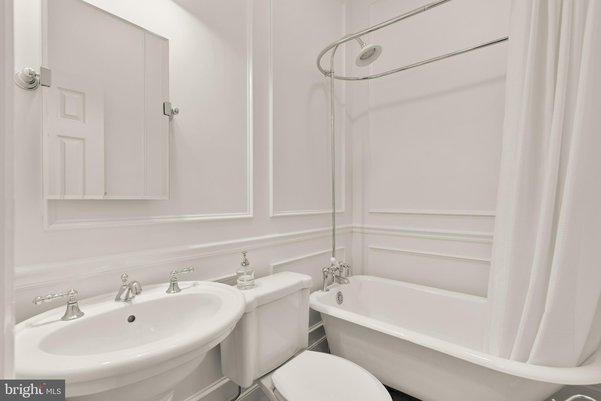 1704 19th Street Northwest, Unit 5 Washington, DC 20009 - Photo 17 of 25 a bathroom with a sink toilet and shower