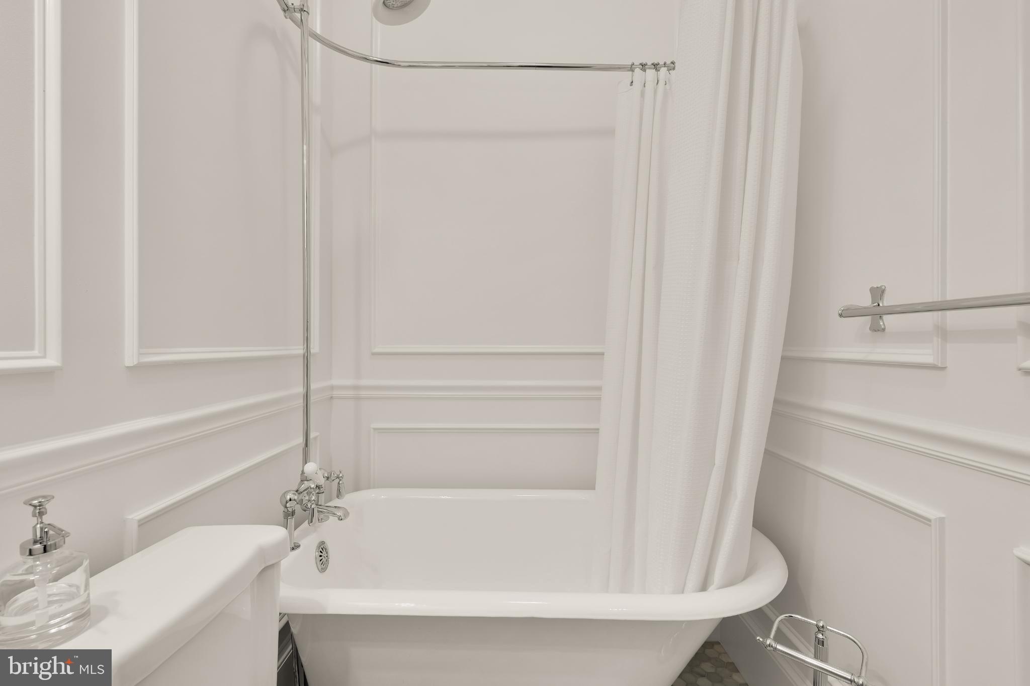 1704 19th Street Northwest, Unit 5 Washington, DC 20009 - Photo 18 of 25 a bathroom with a tub and a sink