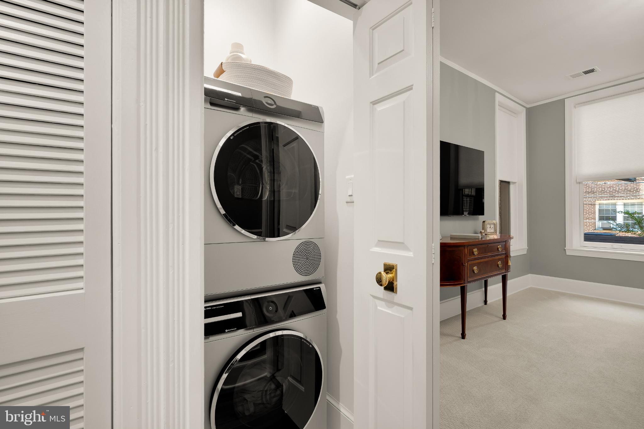 1704 19th Street Northwest, Unit 5 Washington, DC 20009 - Photo 19 of 25 a view of a hallway with washer and dryer