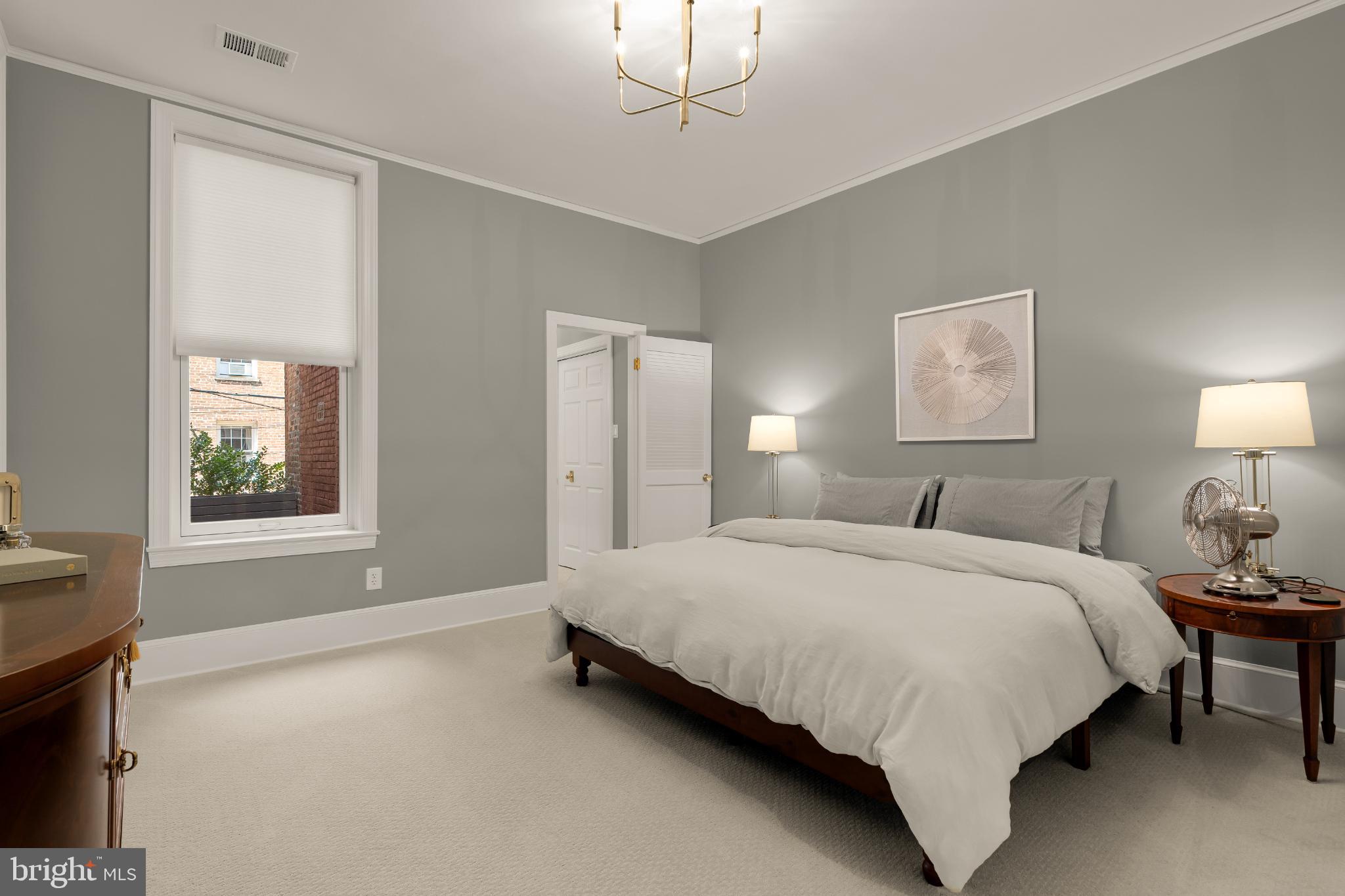 1704 19th Street Northwest, Unit 5 Washington, DC 20009 - Photo 20 of 25 a bedroom with a bed lamp and window