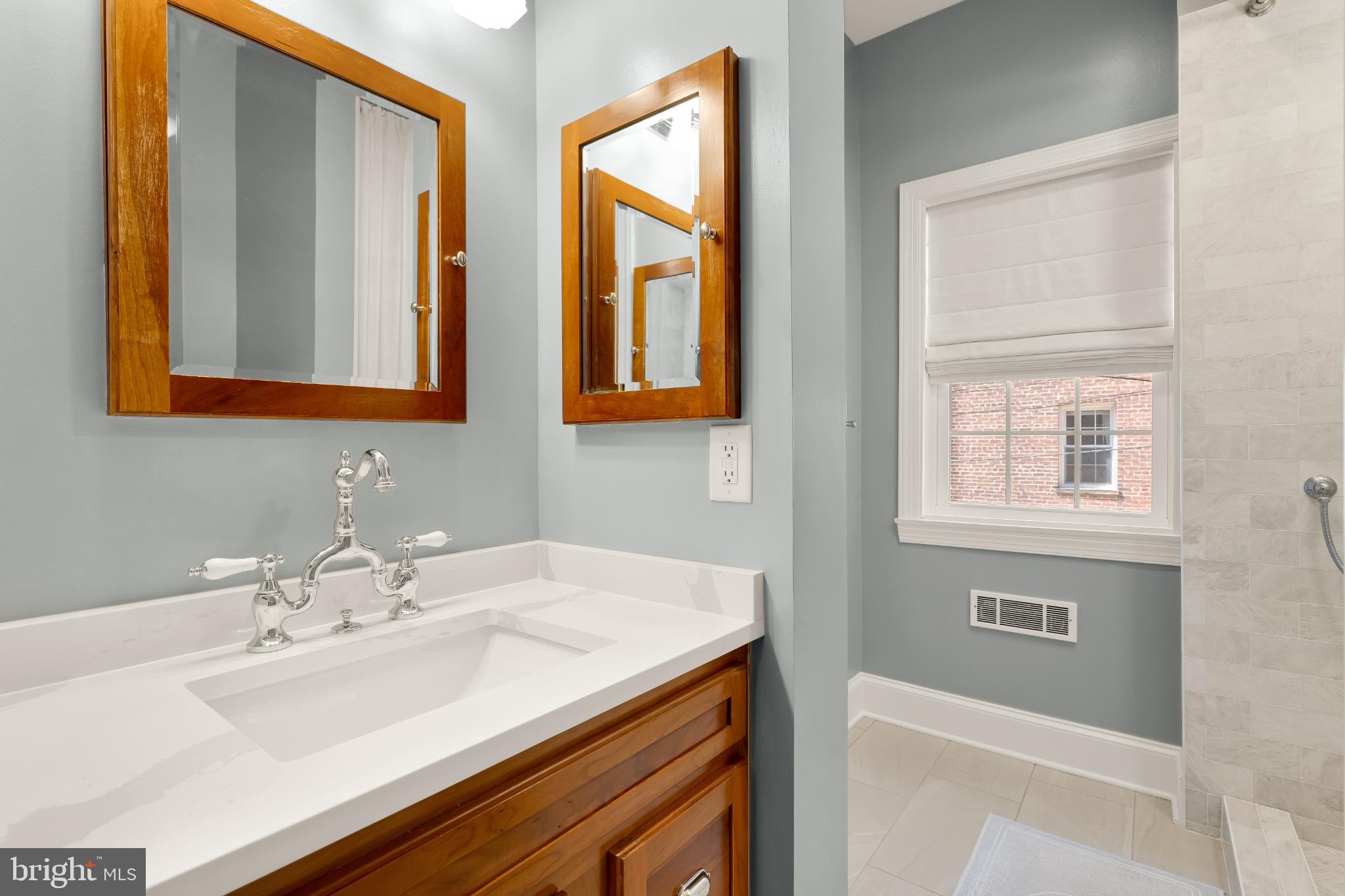 1704 19th Street Northwest, Unit 5 Washington, DC 20009 - Photo 22 of 25 a bathroom with a sink and a mirror