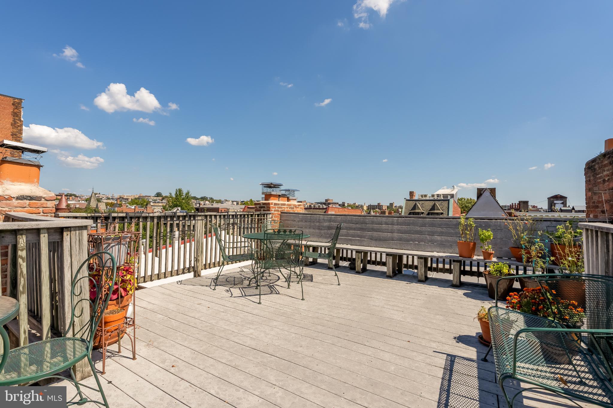 1704 19th Street Northwest, Unit 5 Washington, DC 20009 - Photo 24 of 25 a terrace with wooden floor table and chairs