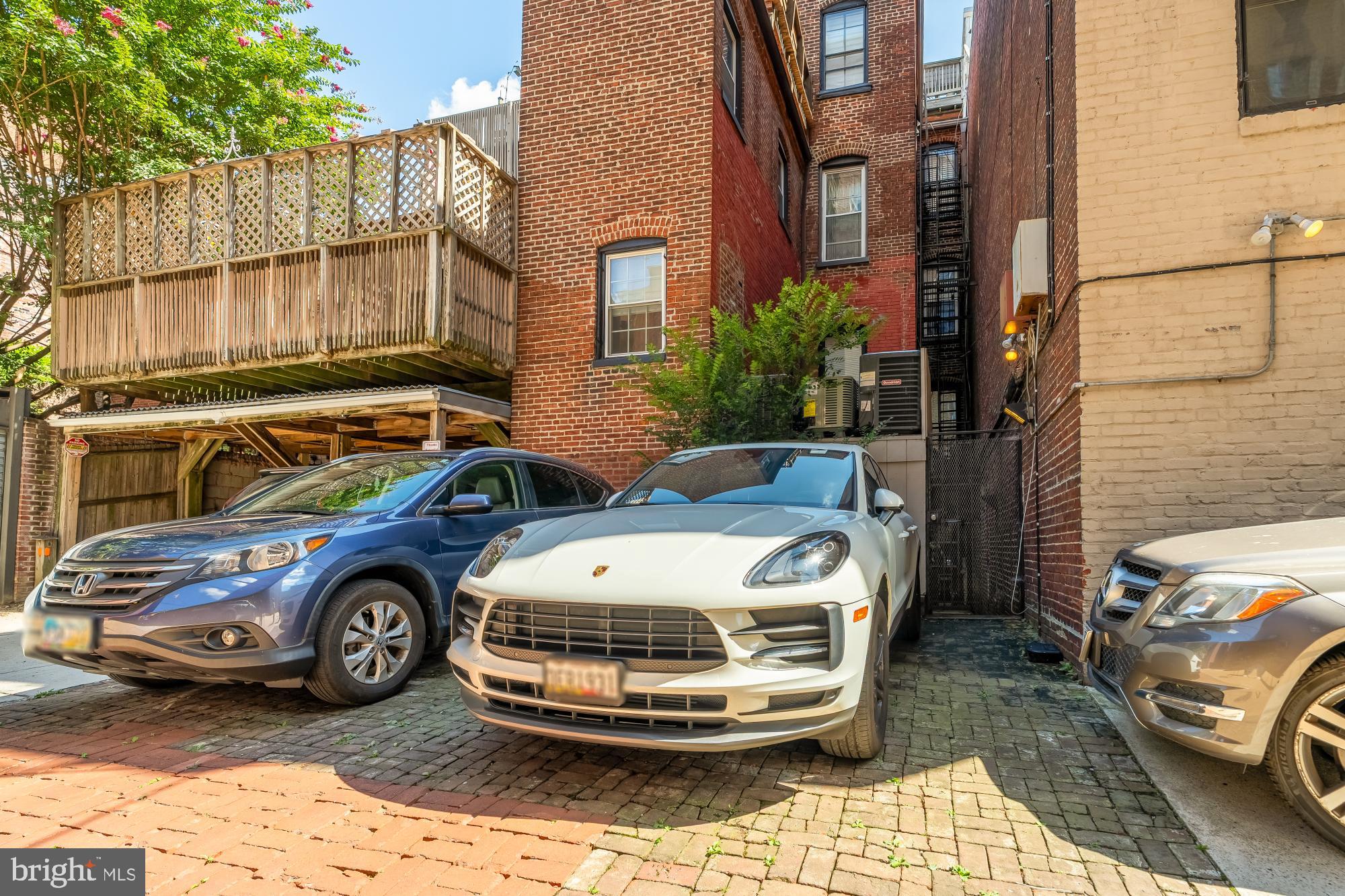 1704 19th Street Northwest, Unit 5 Washington, DC 20009 - Photo 25 of 25 a car parked in front of a brick house