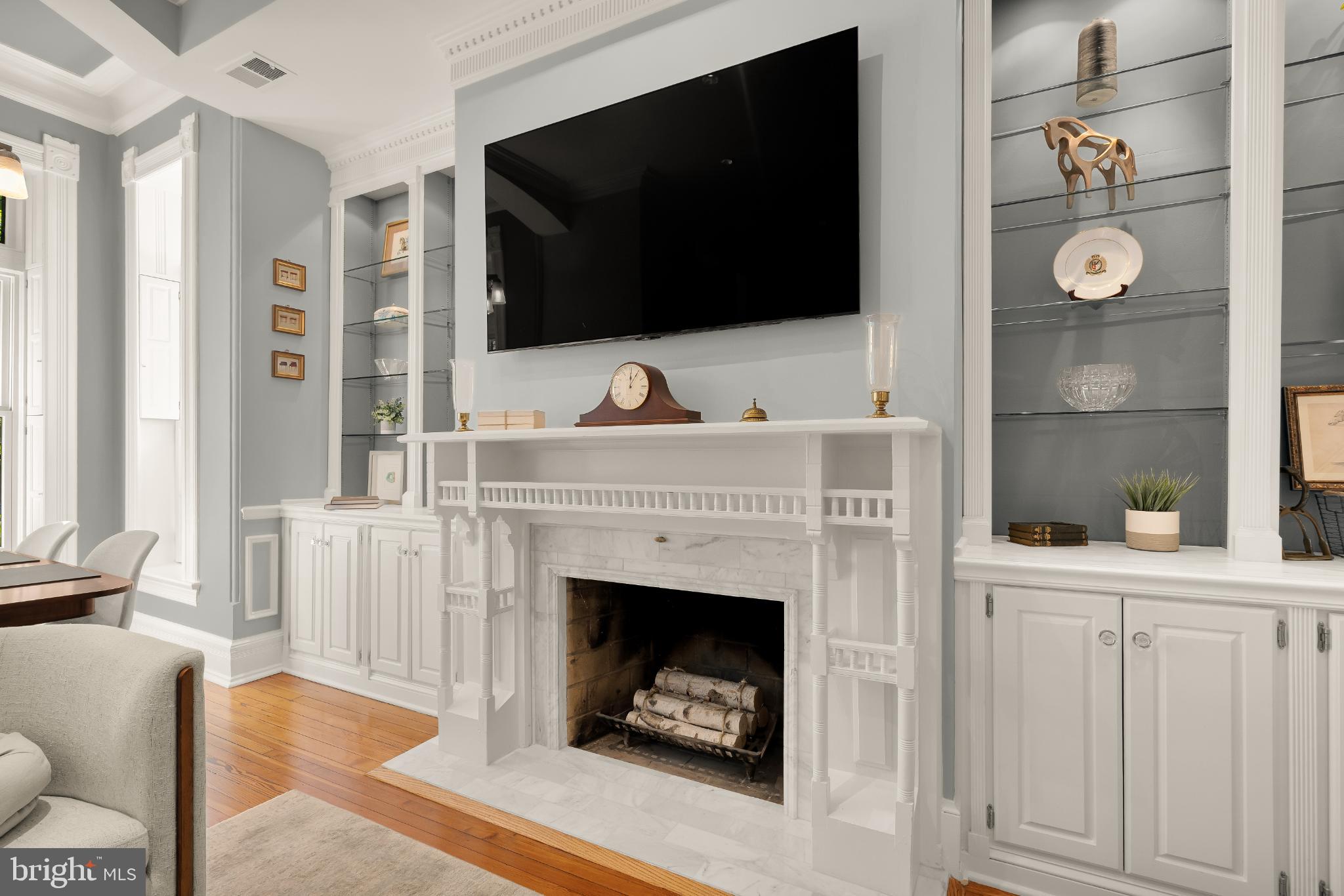 1704 19th Street Northwest, Unit 5 Washington, DC 20009 - Photo 8 of 25 a living room with a fireplace and a flat screen tv