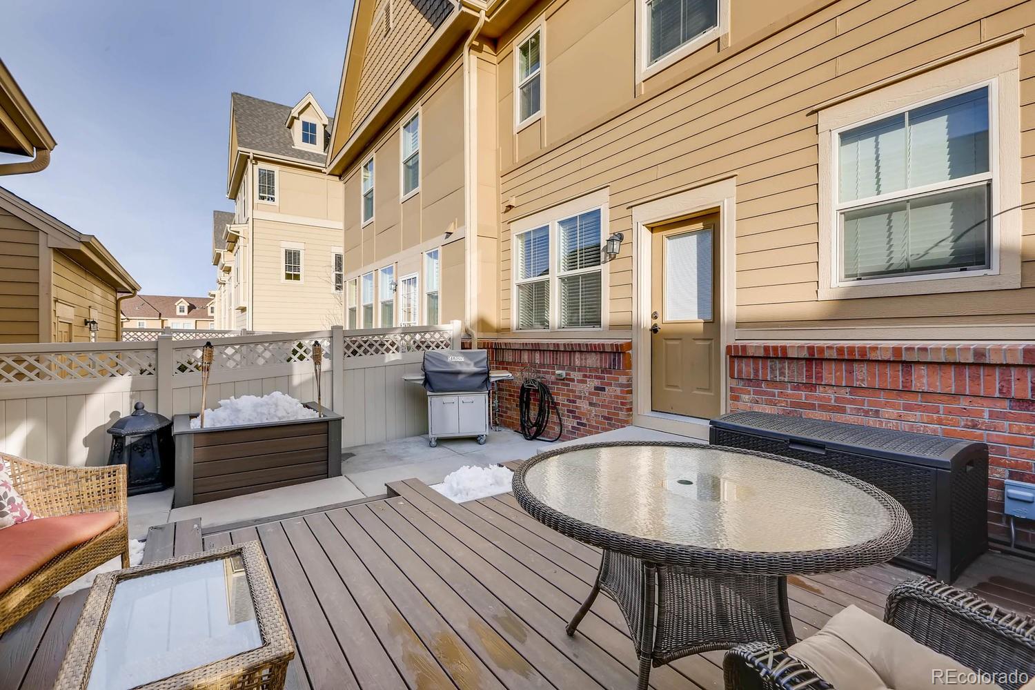 10261 Bellwether Lane Lone Tree, CO 80124 - Photo 21 of 35 a balcony with table and chairs