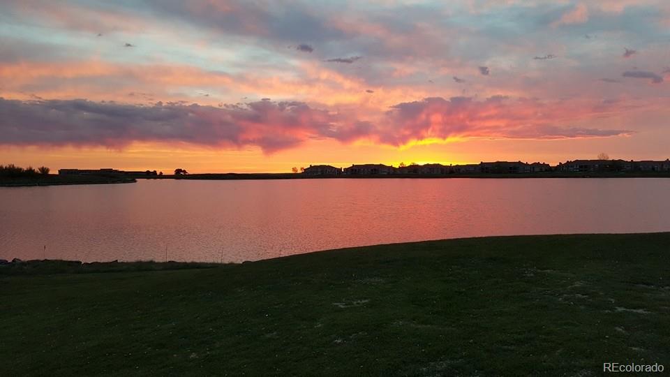10261 Bellwether Lane Lone Tree, CO 80124 - Photo 32 of 35 a view of a lake and sunset
