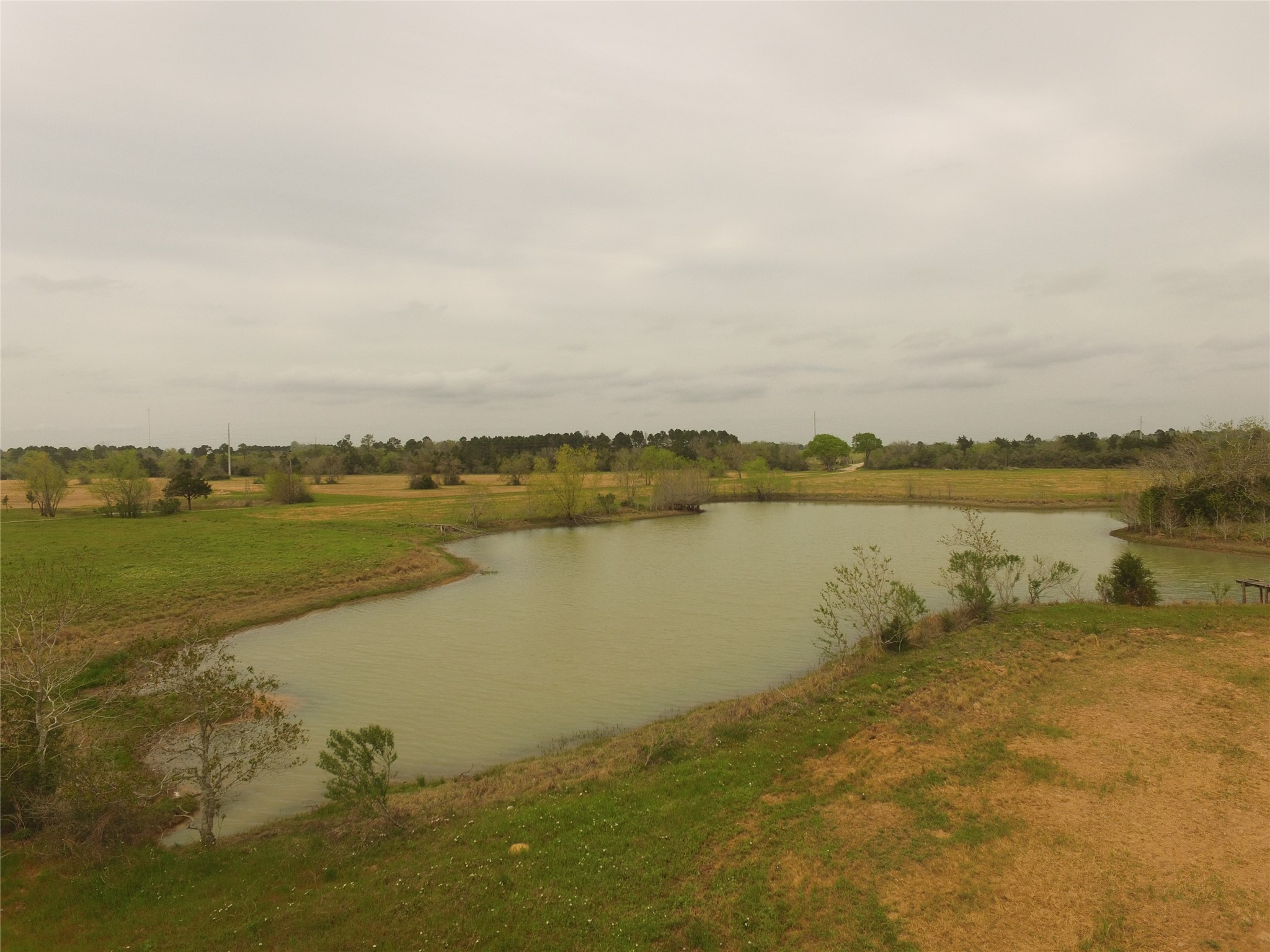 0 Kloss Road Sealy, TX 77474 - Photo 8 of 10 a view of a lake with houses in the back