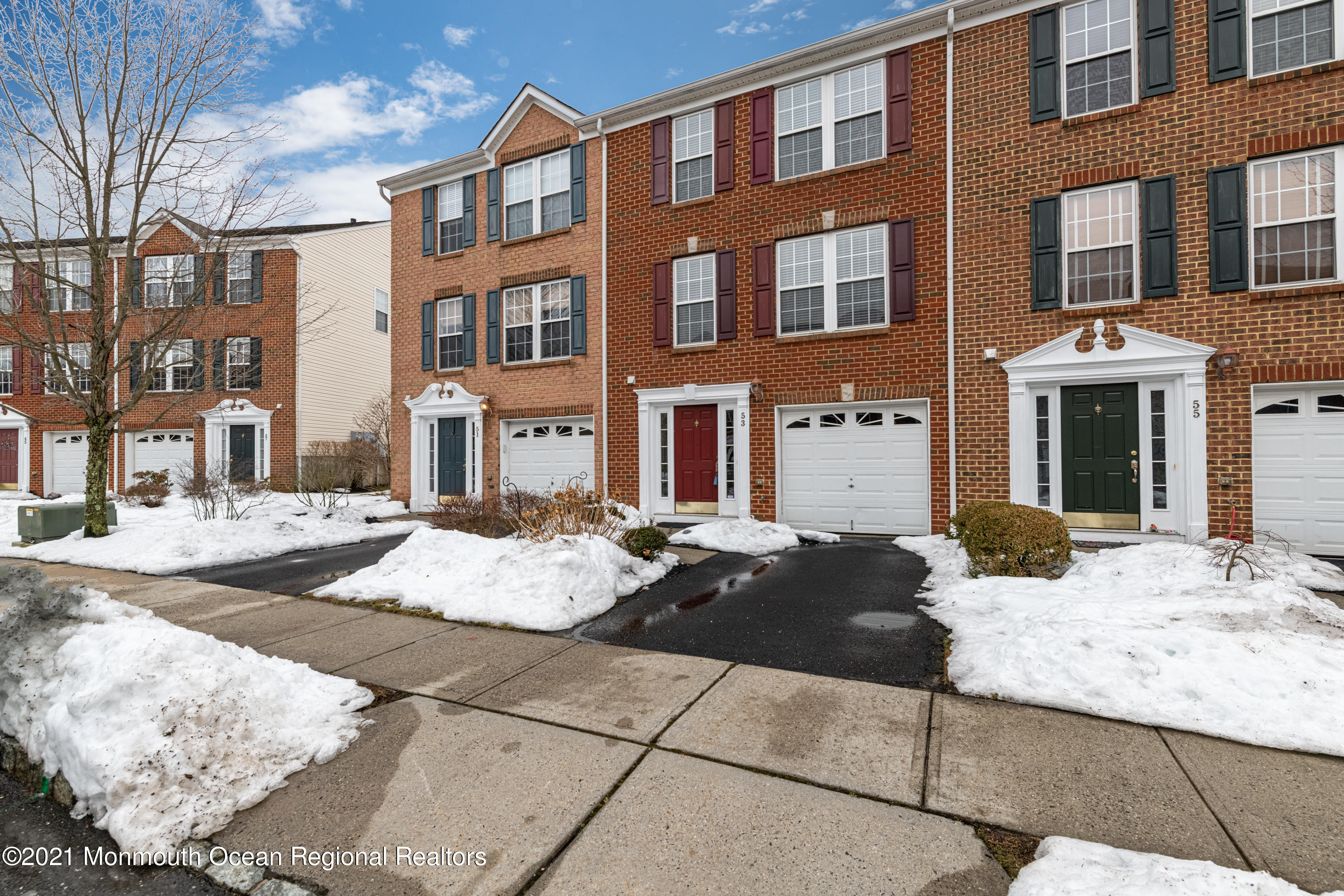 a view of a brick building next to a yard