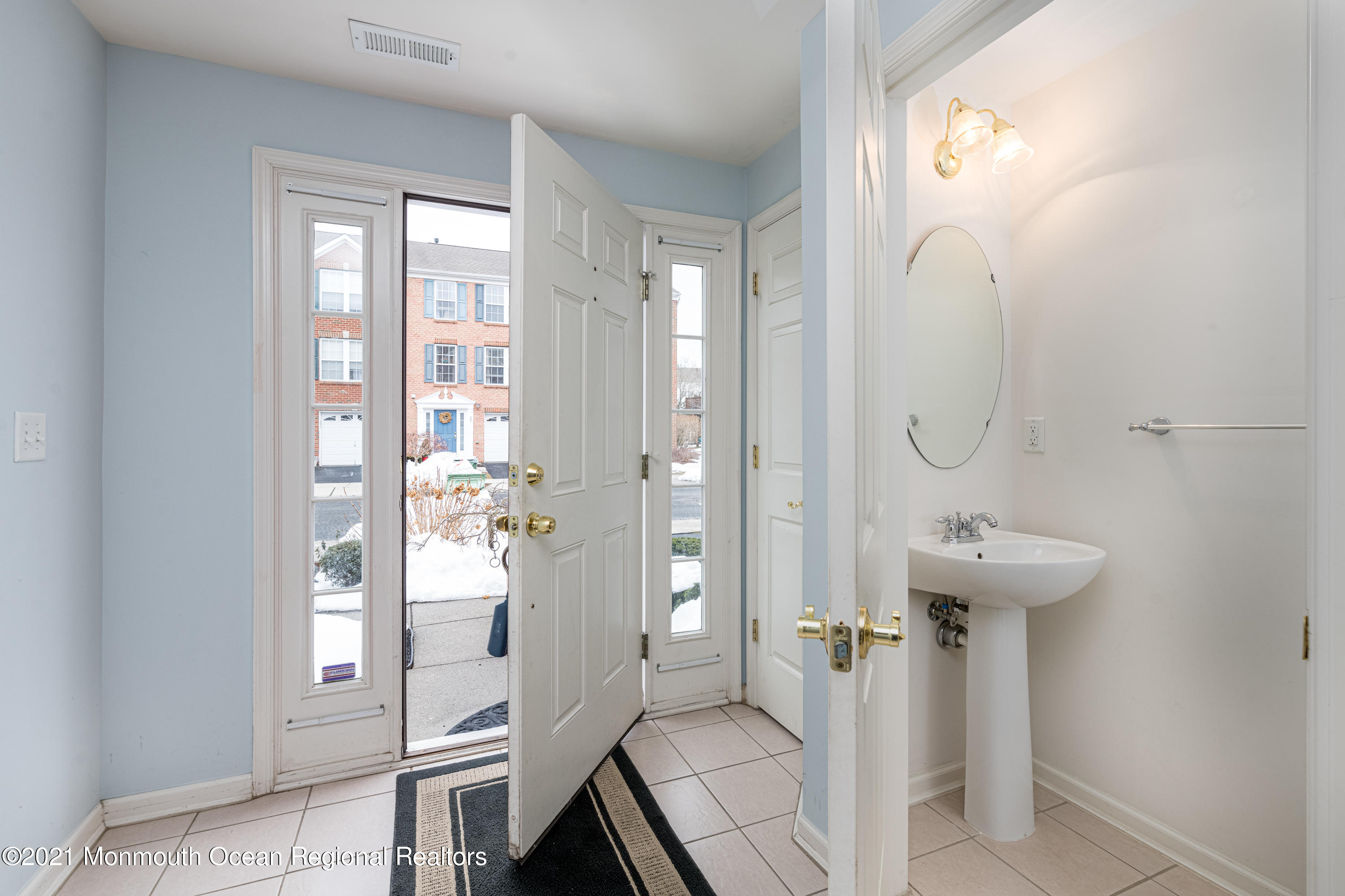 53 Saxton Road Farmingdale, NJ 07727 - Photo 2 of 22 a bathroom with a sink a mirror and a shower