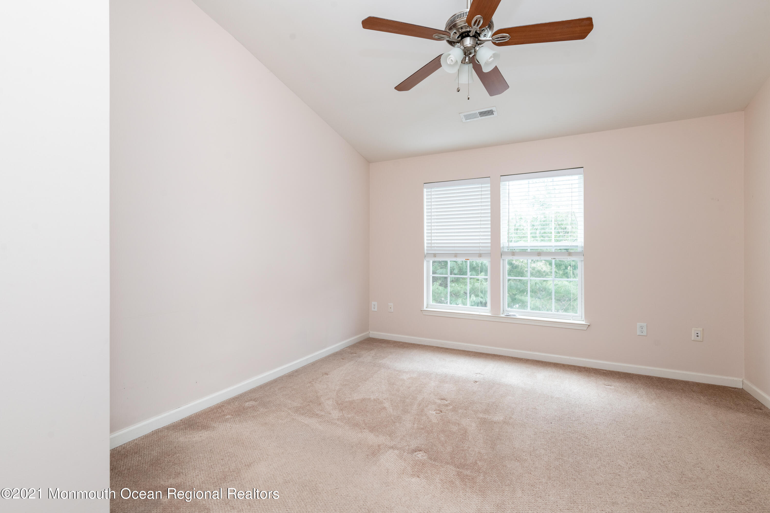 53 Saxton Road Farmingdale, NJ 07727 - Photo 16 of 22 an empty room with windows and fan