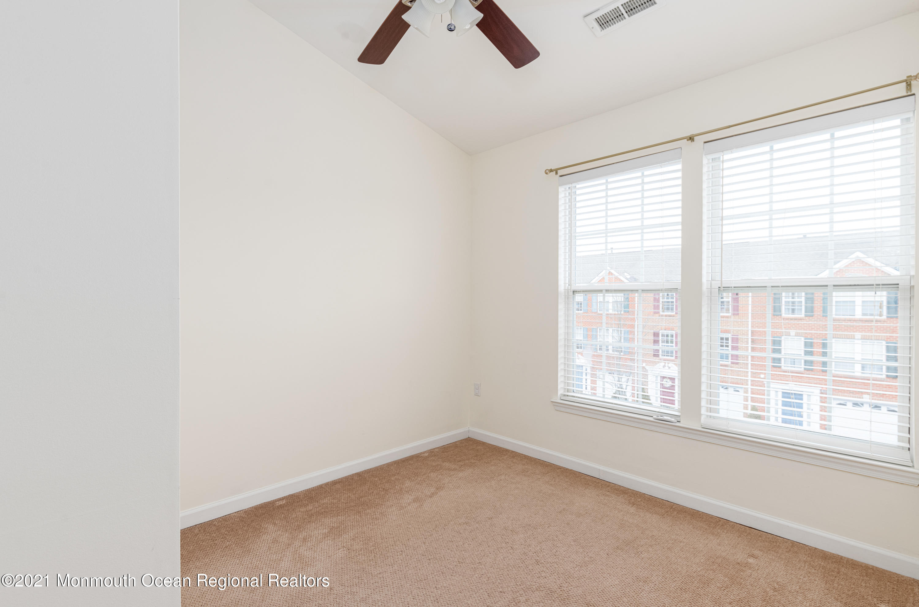 53 Saxton Road Farmingdale, NJ 07727 - Photo 18 of 22 an empty room with ceiling fan and window
