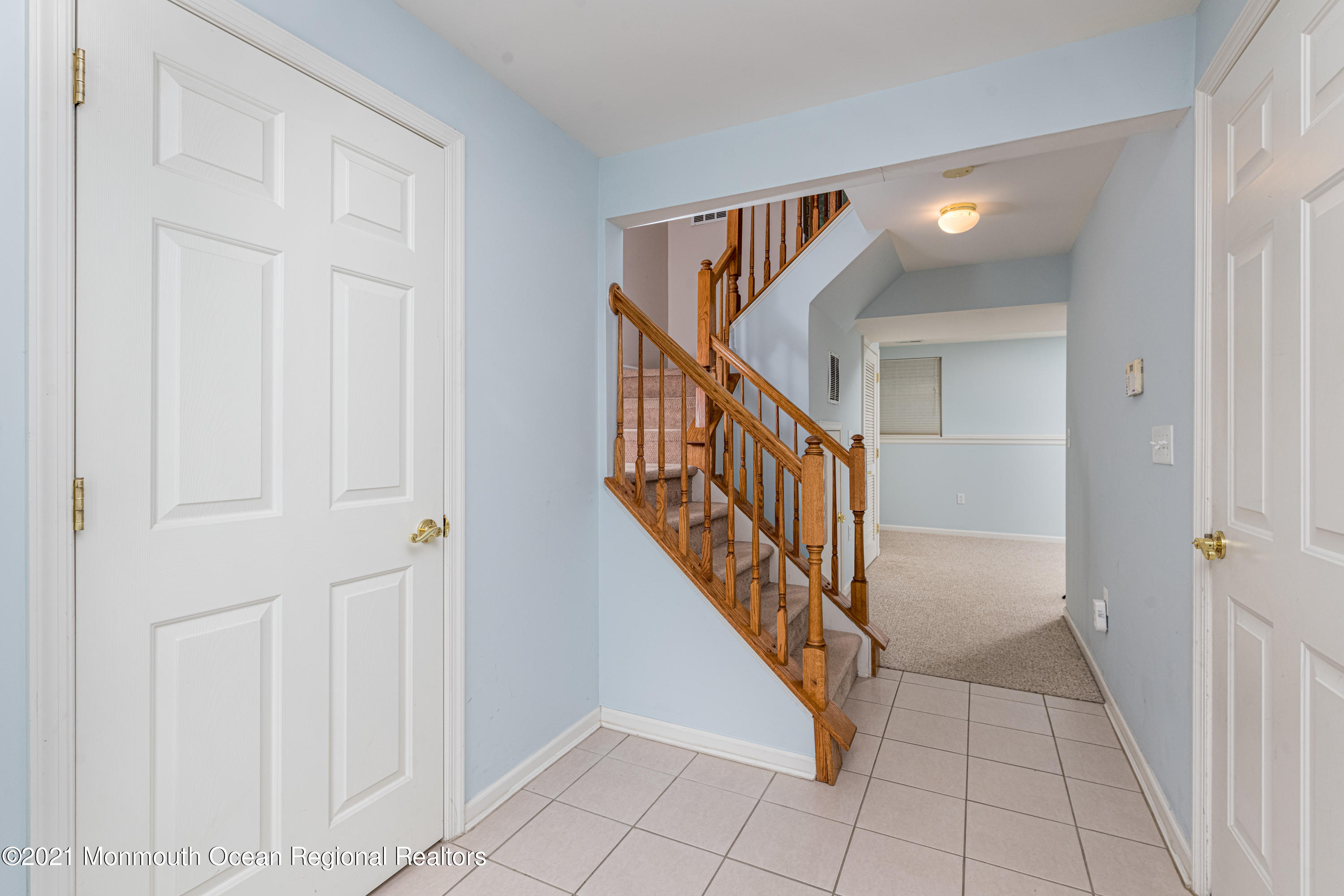 53 Saxton Road Farmingdale, NJ 07727 - Photo 3 of 22 a view of a hallway with wooden floor and entryway