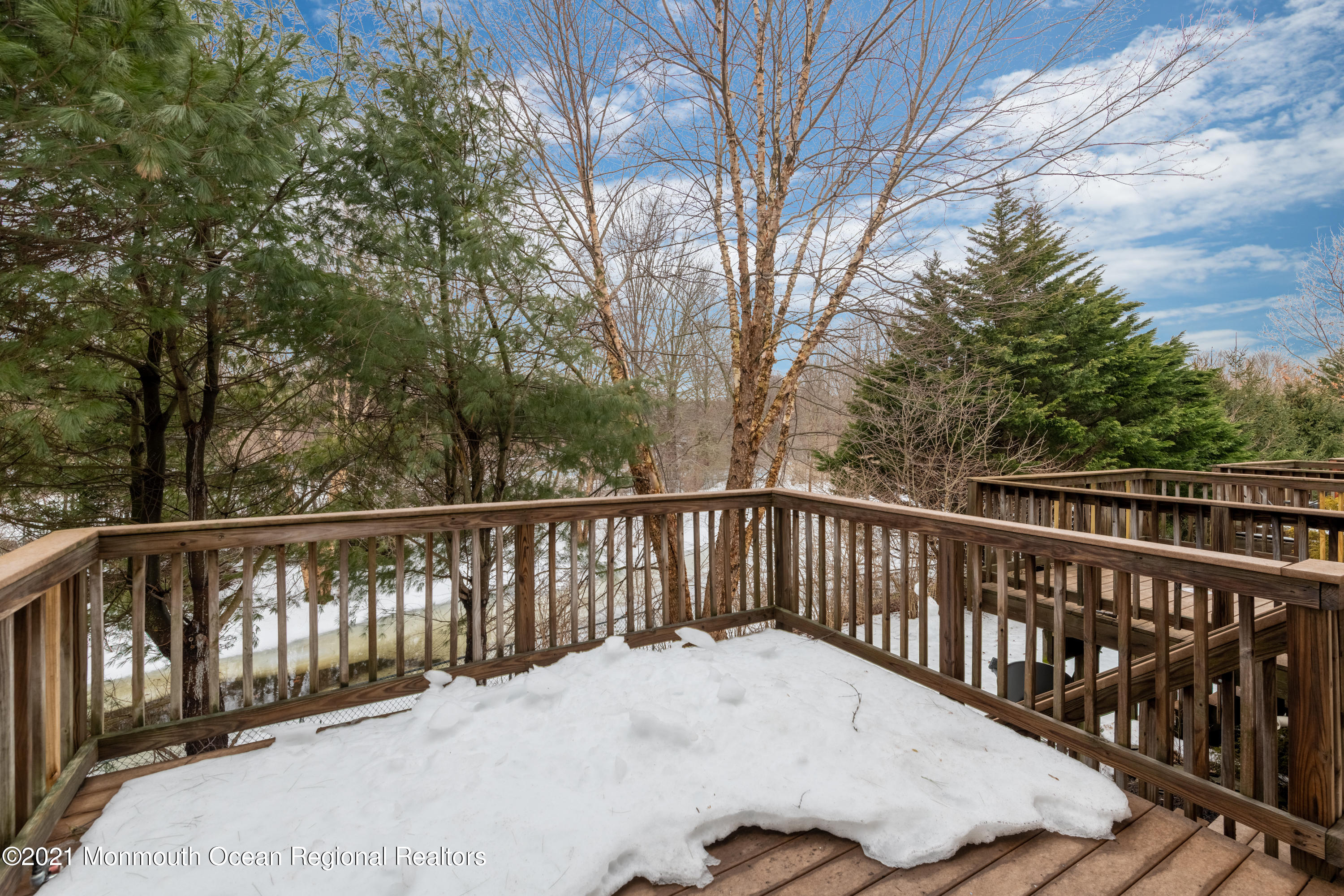 53 Saxton Road Farmingdale, NJ 07727 - Photo 21 of 22 a view of balcony with wooden fence and floor