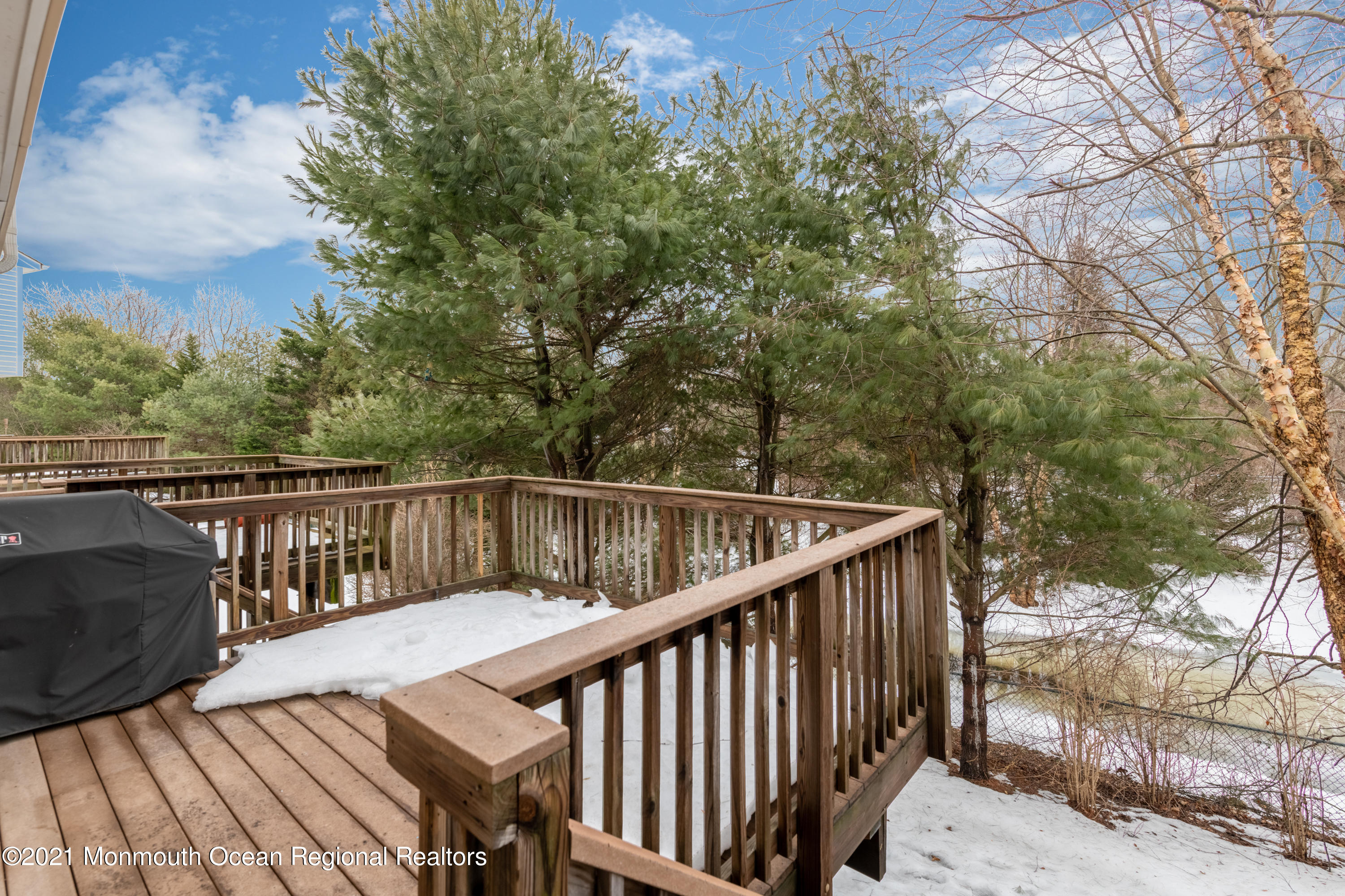 53 Saxton Road Farmingdale, NJ 07727 - Photo 22 of 22 a view of balcony with wooden floor and fence