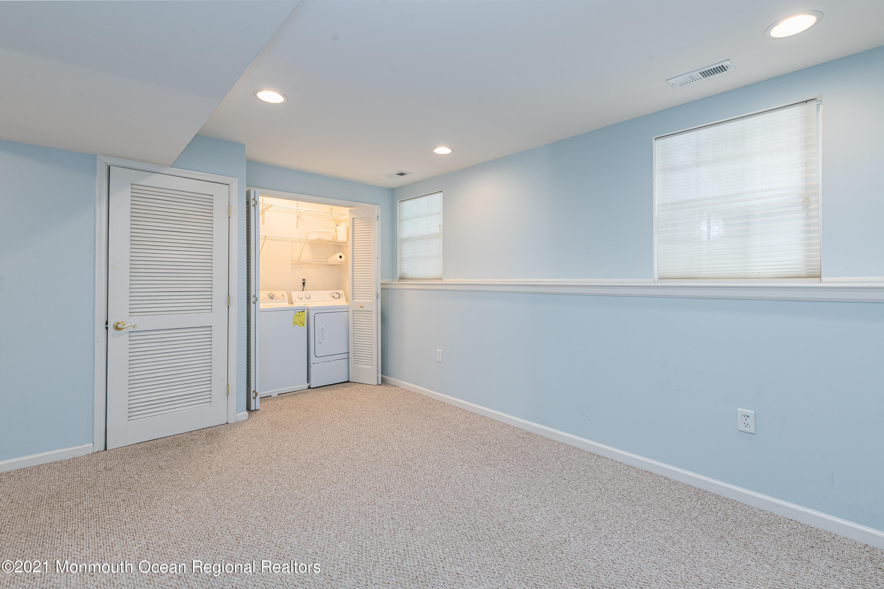 53 Saxton Road Farmingdale, NJ 07727 - Photo 5 of 22 a view of an empty room with window and cabinet