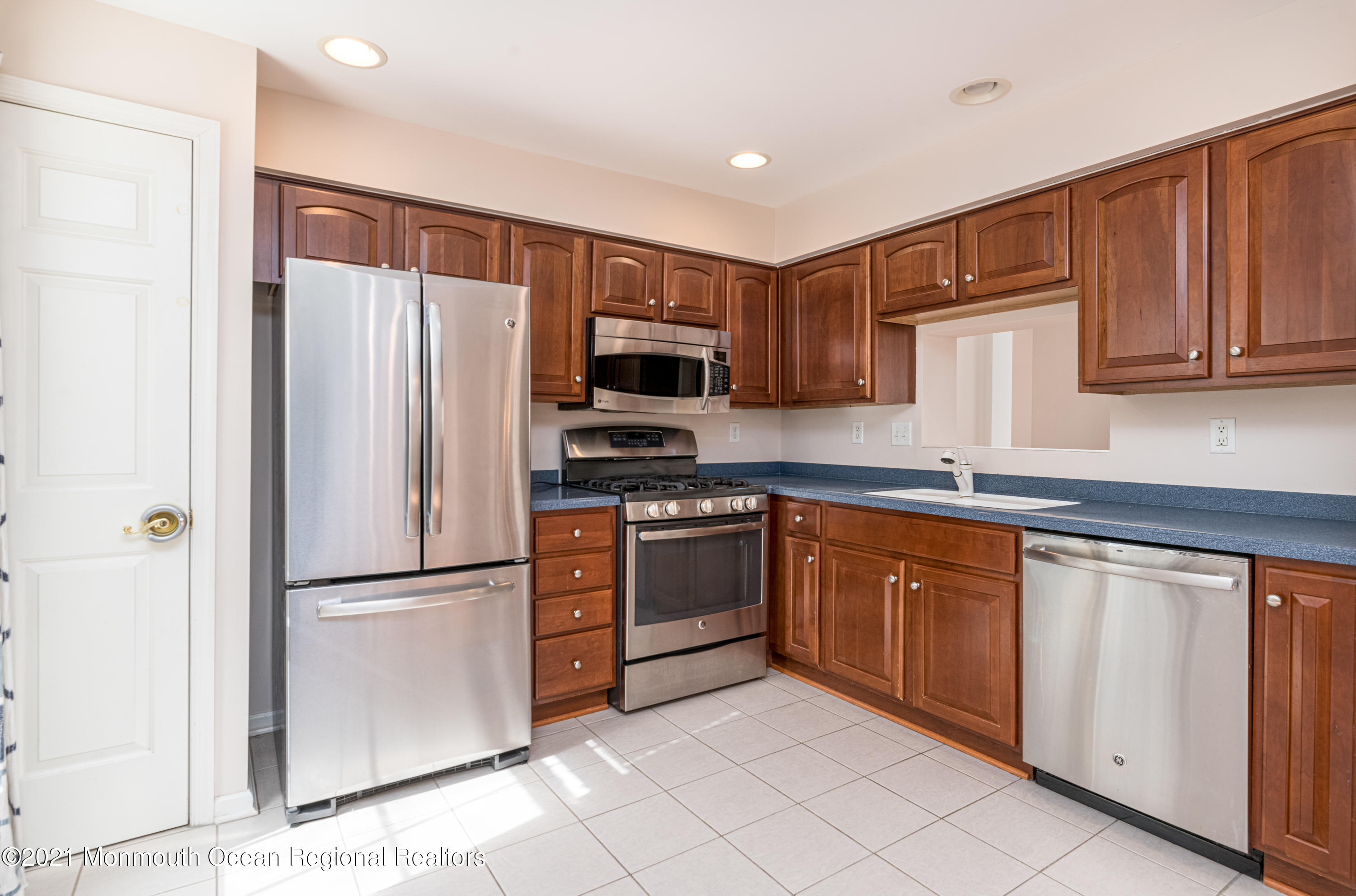 53 Saxton Road Farmingdale, NJ 07727 - Photo 6 of 22 a kitchen with stainless steel appliances granite countertop a refrigerator sink and microwave