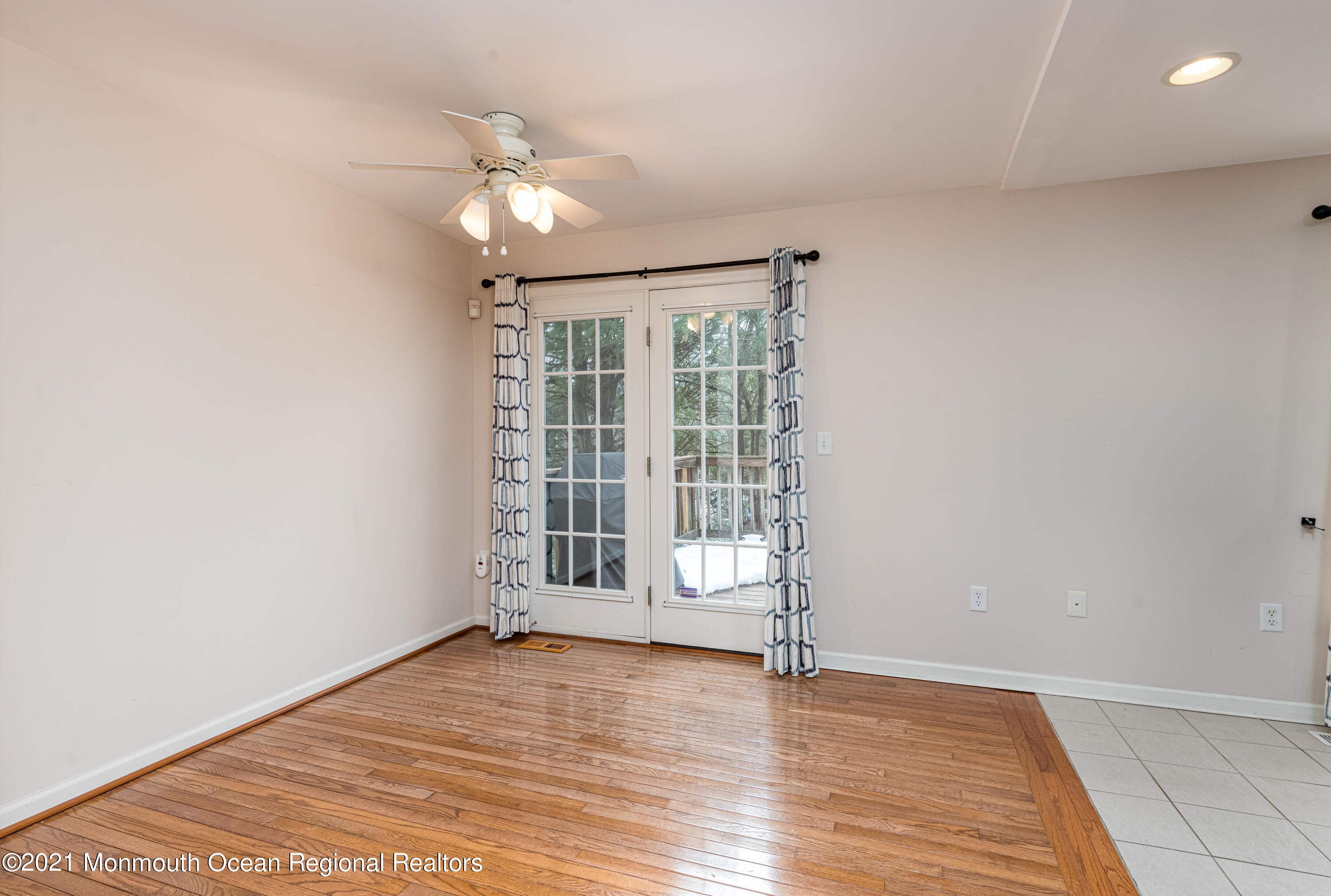 53 Saxton Road Farmingdale, NJ 07727 - Photo 9 of 22 wooden floor in an empty room with a window