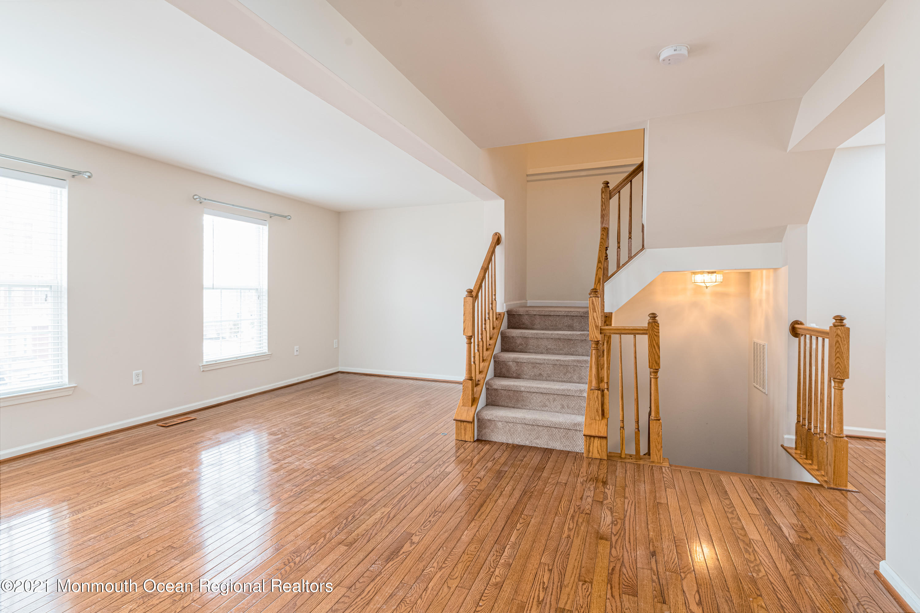 53 Saxton Road Farmingdale, NJ 07727 - Photo 10 of 22 wooden floor in an empty room with a window