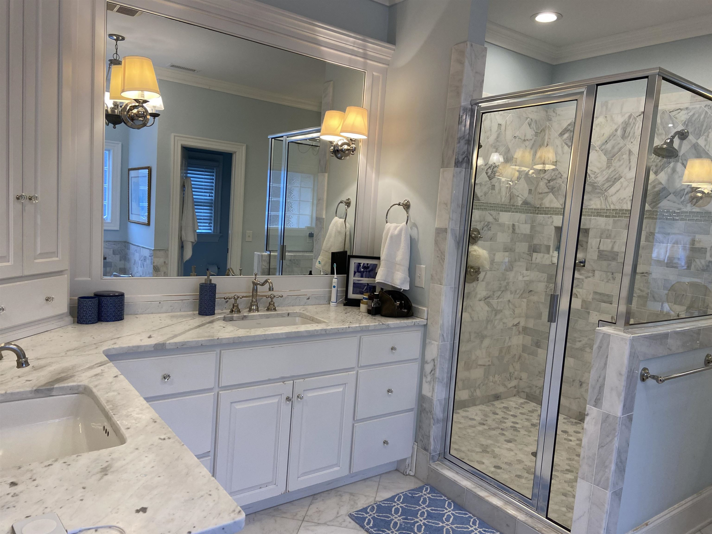 3319 Hampton Road Raleigh, NC 27607 - Photo 13 of 18 a bathroom with a shower sink and mirror