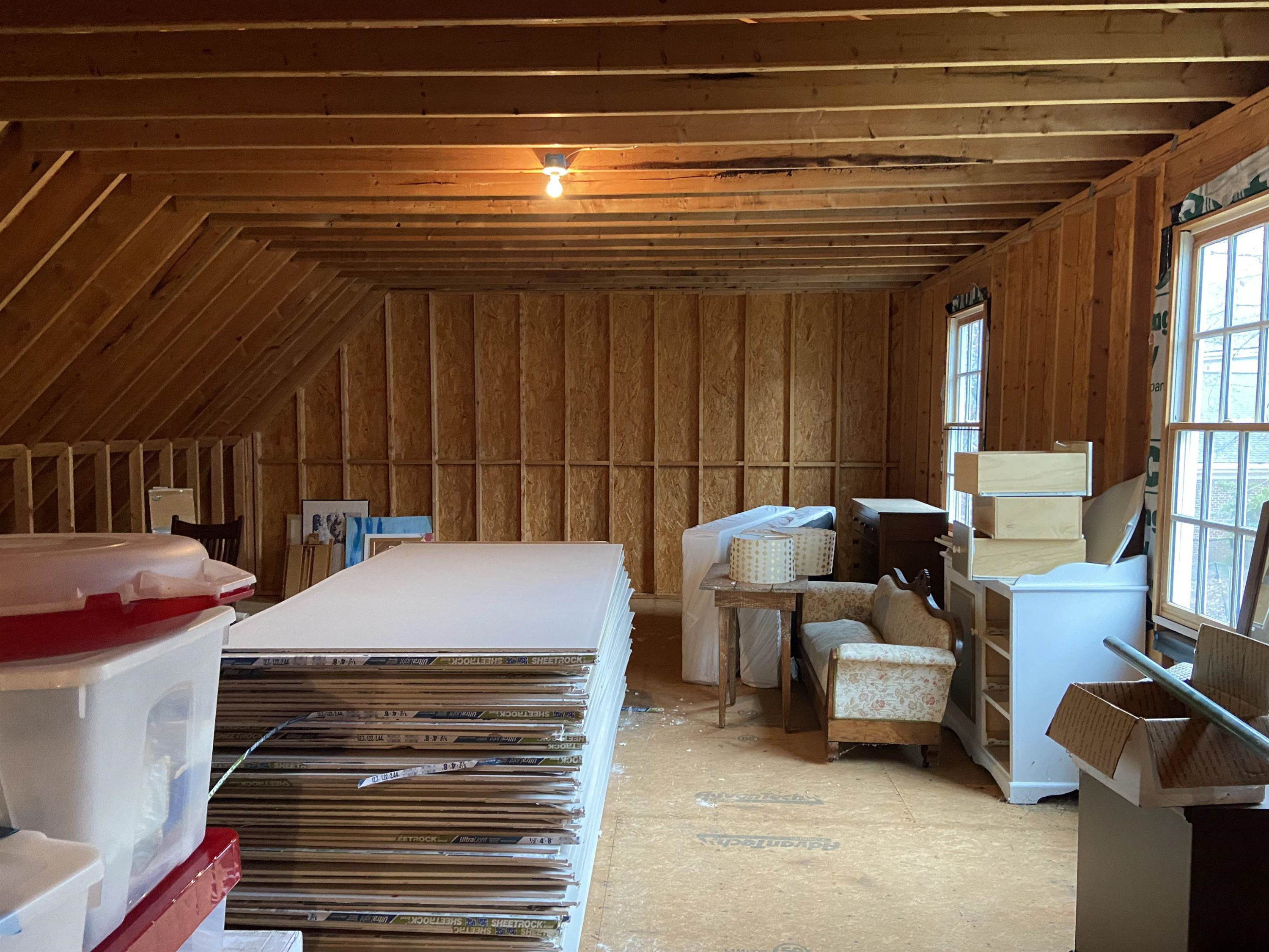 3319 Hampton Road Raleigh, NC 27607 - Photo 17 of 18 a bed room with a bed and a chandelier