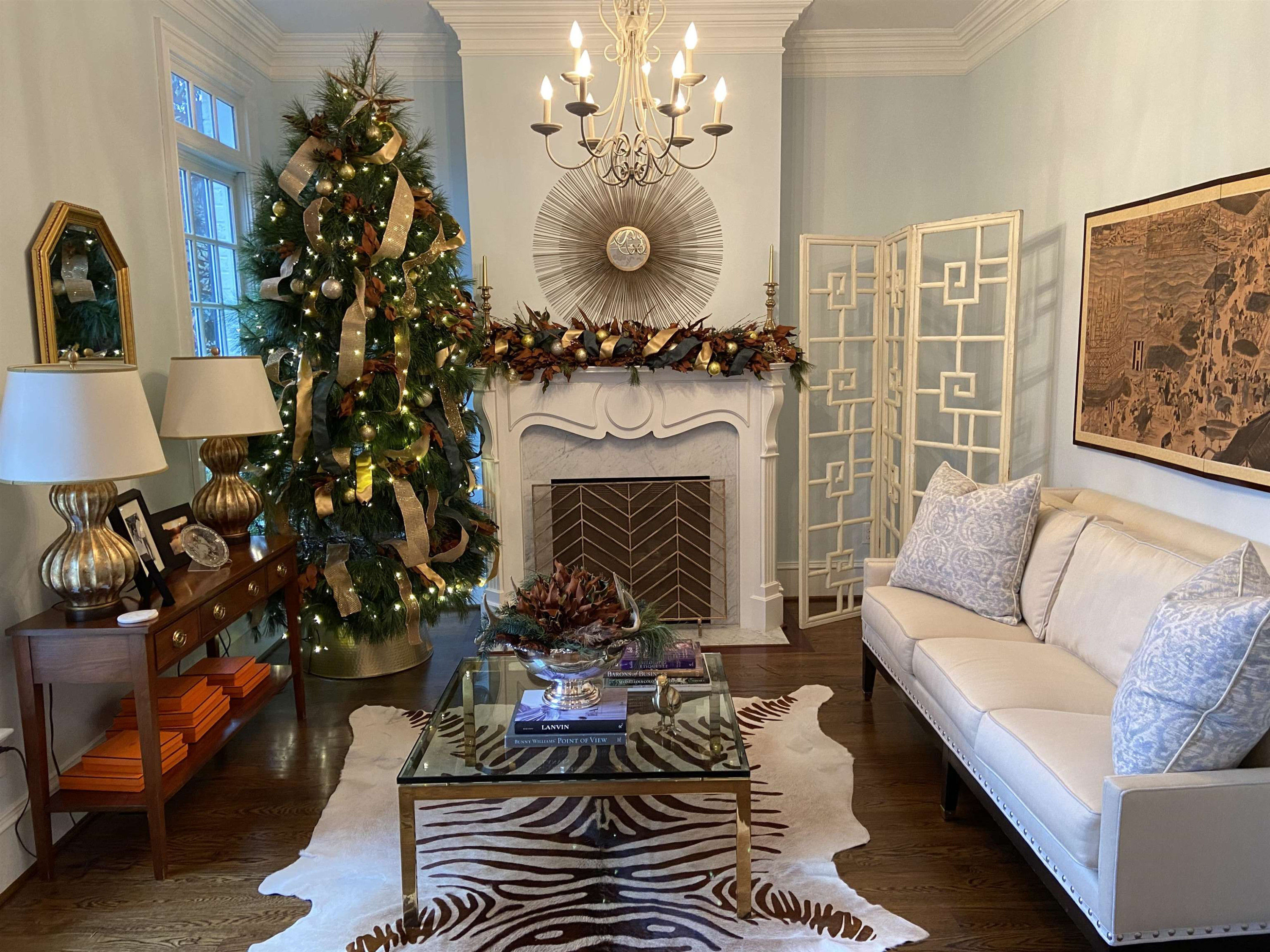 3319 Hampton Road Raleigh, NC 27607 - Photo 2 of 18 a living room with furniture a fireplace and a chandelier