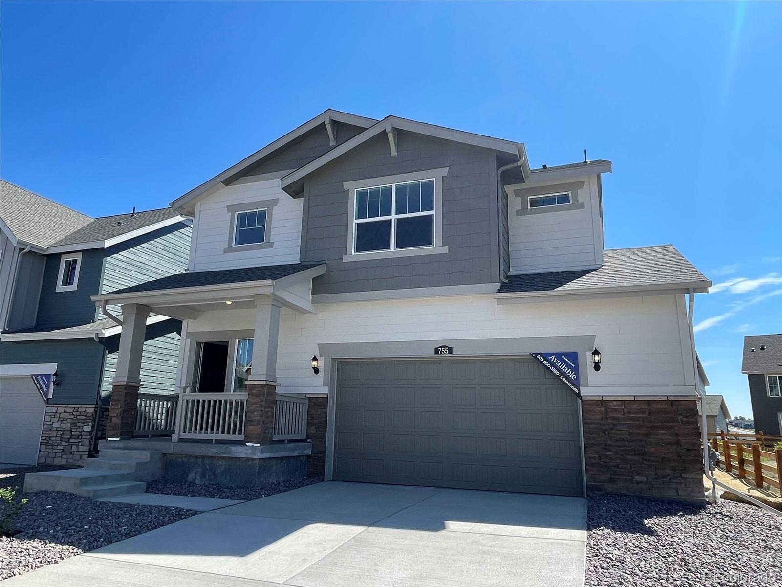 a front view of a house with a garage