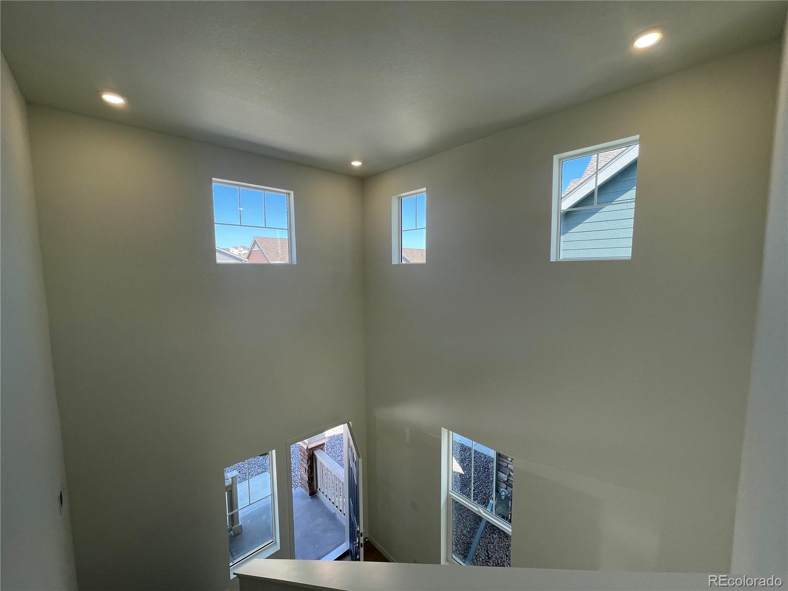755 Yankee Boy Loop Elizabeth, CO 80107 - Photo 12 of 31 a view of room with stairs and wooden floor