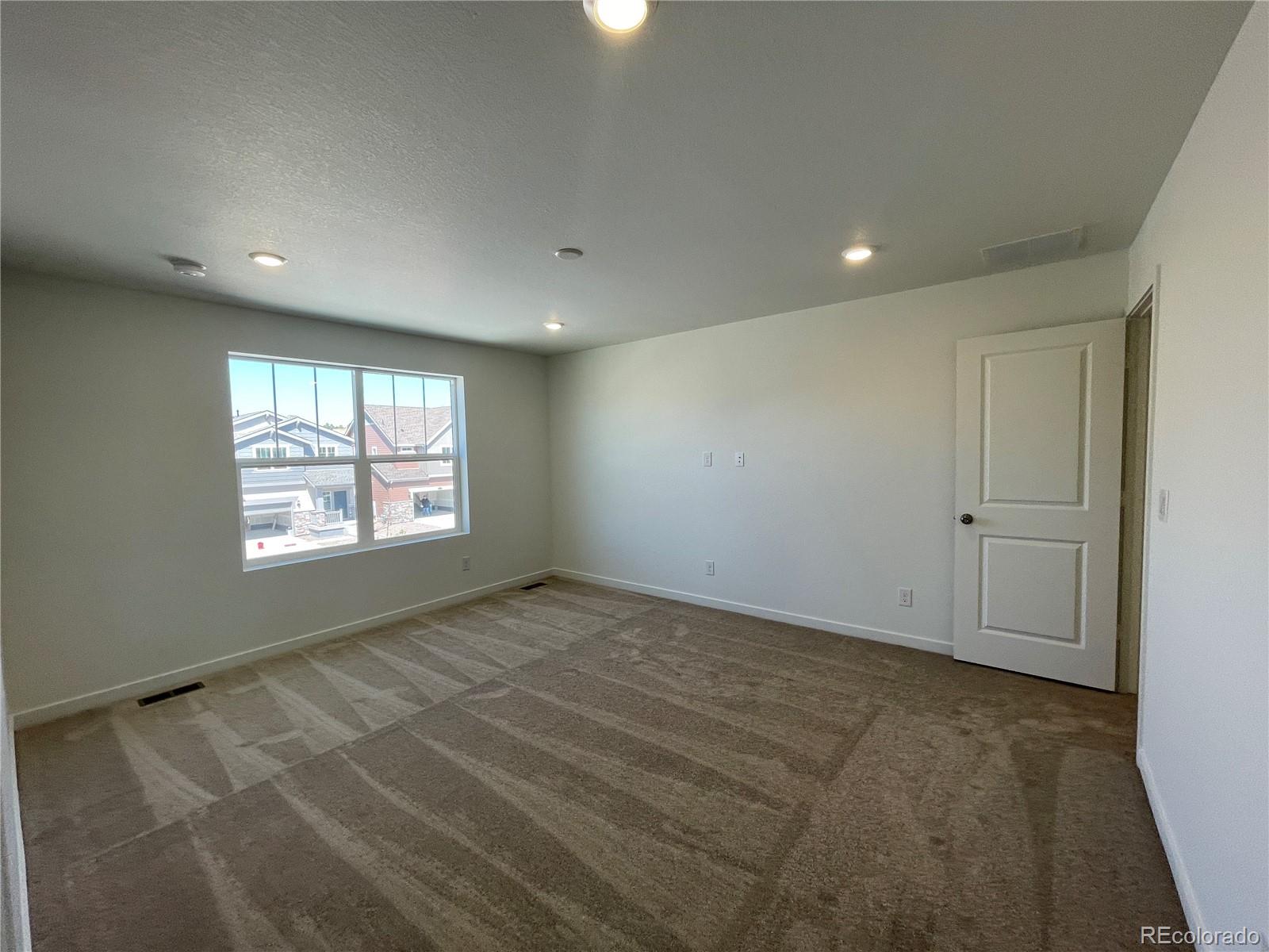 755 Yankee Boy Loop Elizabeth, CO 80107 - Photo 14 of 31 a view of an empty room and window